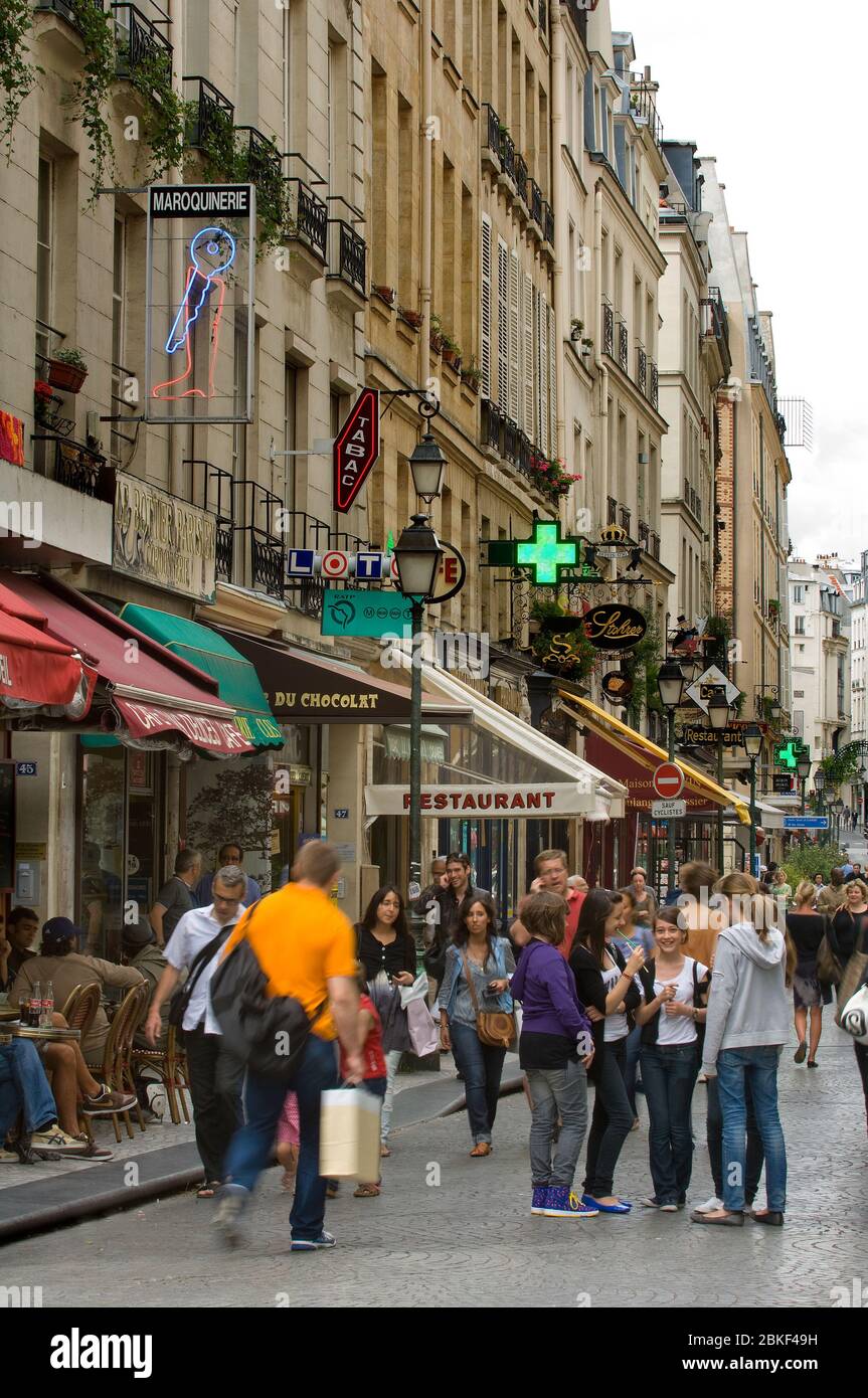 People on the street,shops, cafes and signs, Rue Montorgueil, Paris , France Stock Photo