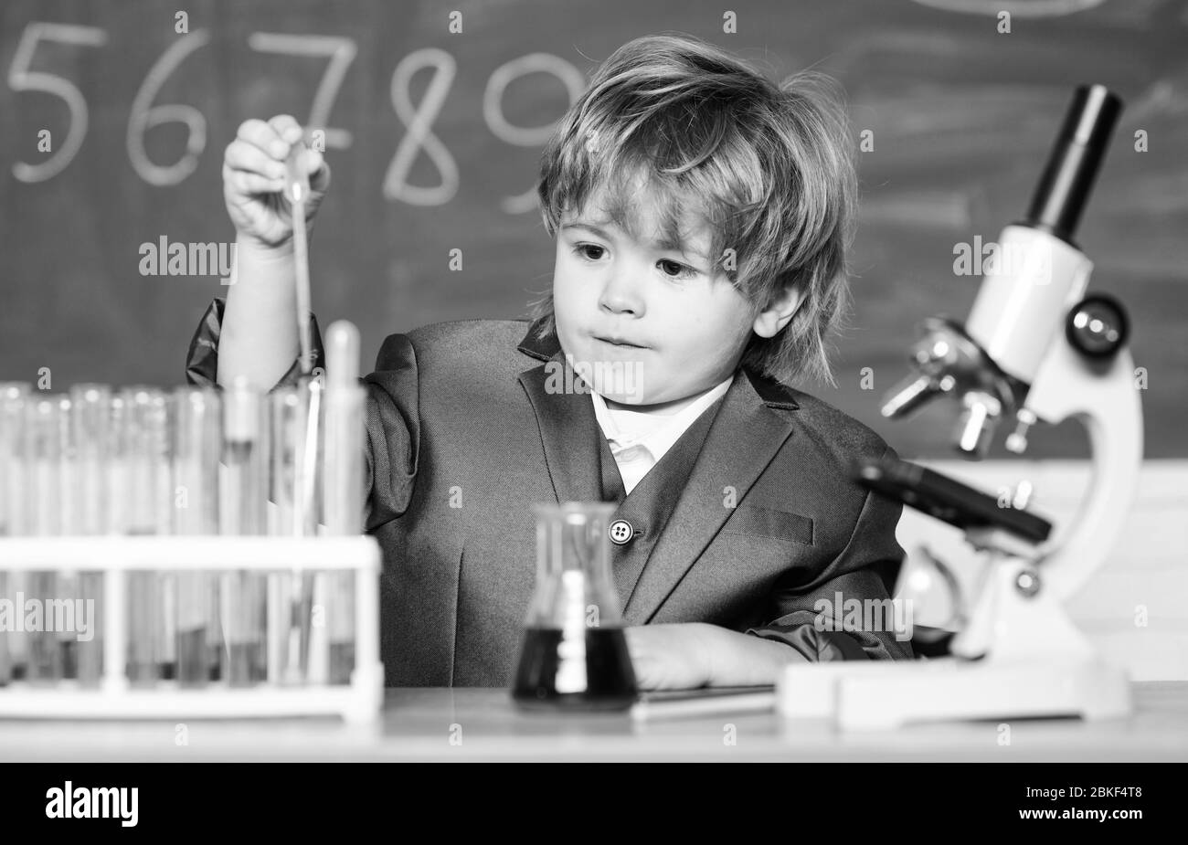 Biology school laboratory equipment. Little boy in the laboratory