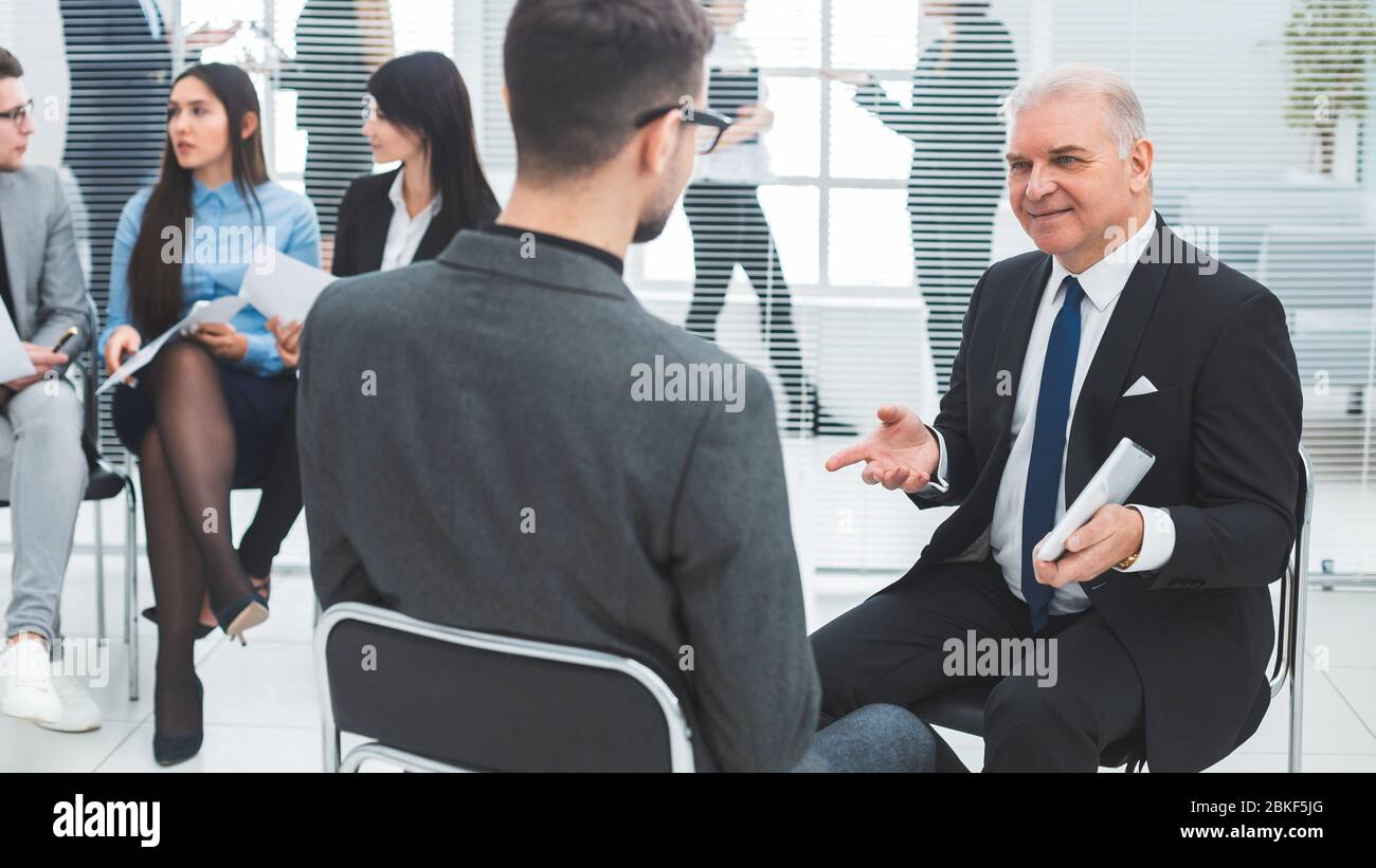 business man explaining something to his colleague. Stock Photo