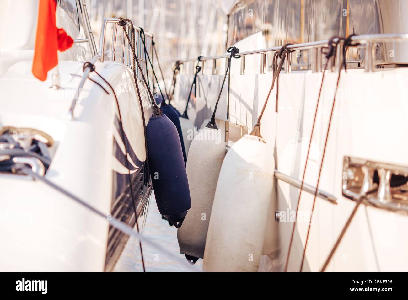 Protecting stern of boat from scratches in parking lot pier Stock Photo ...