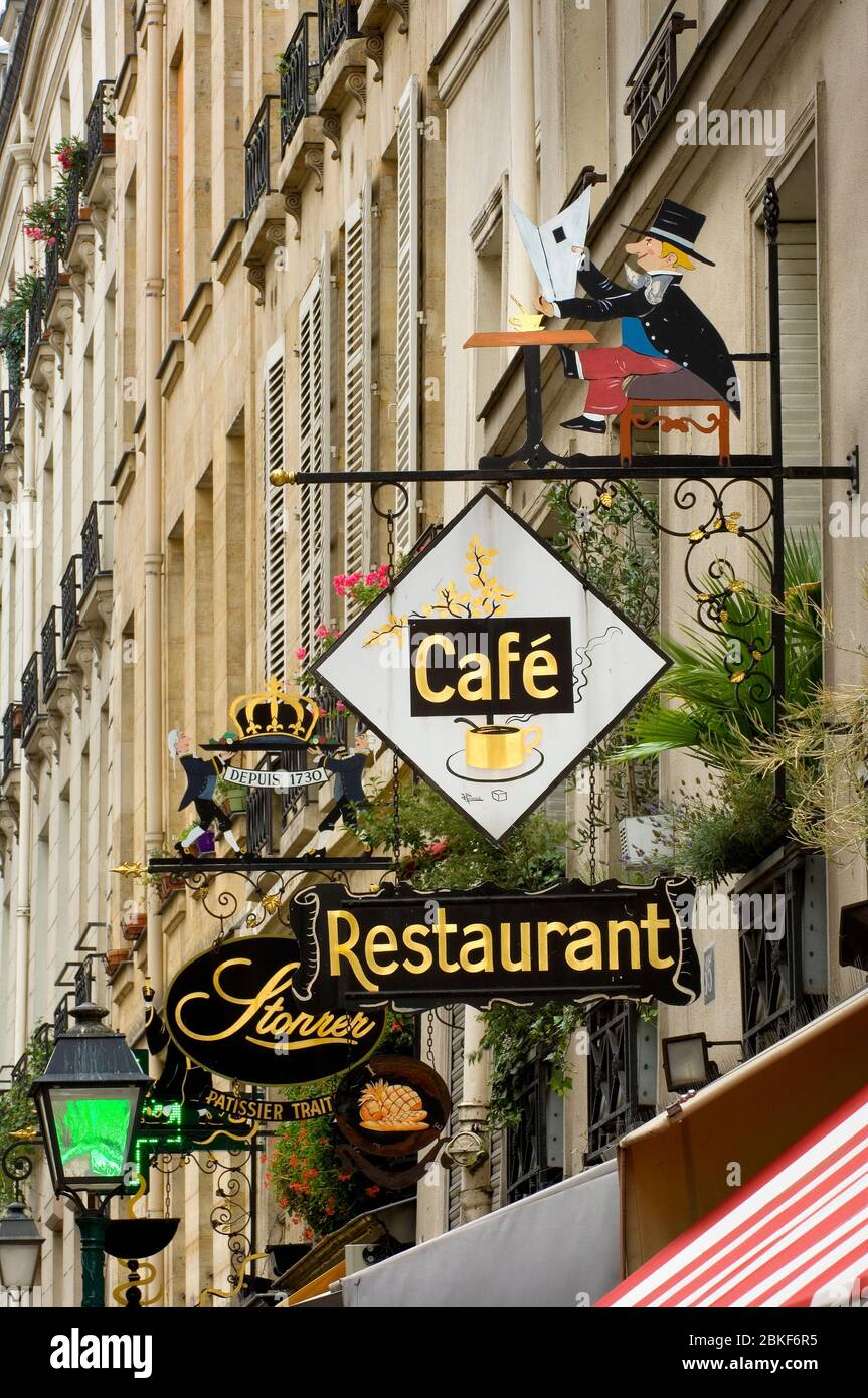 Cafe and restaurant signs, Rue Montorgueil, Paris , France Stock Photo