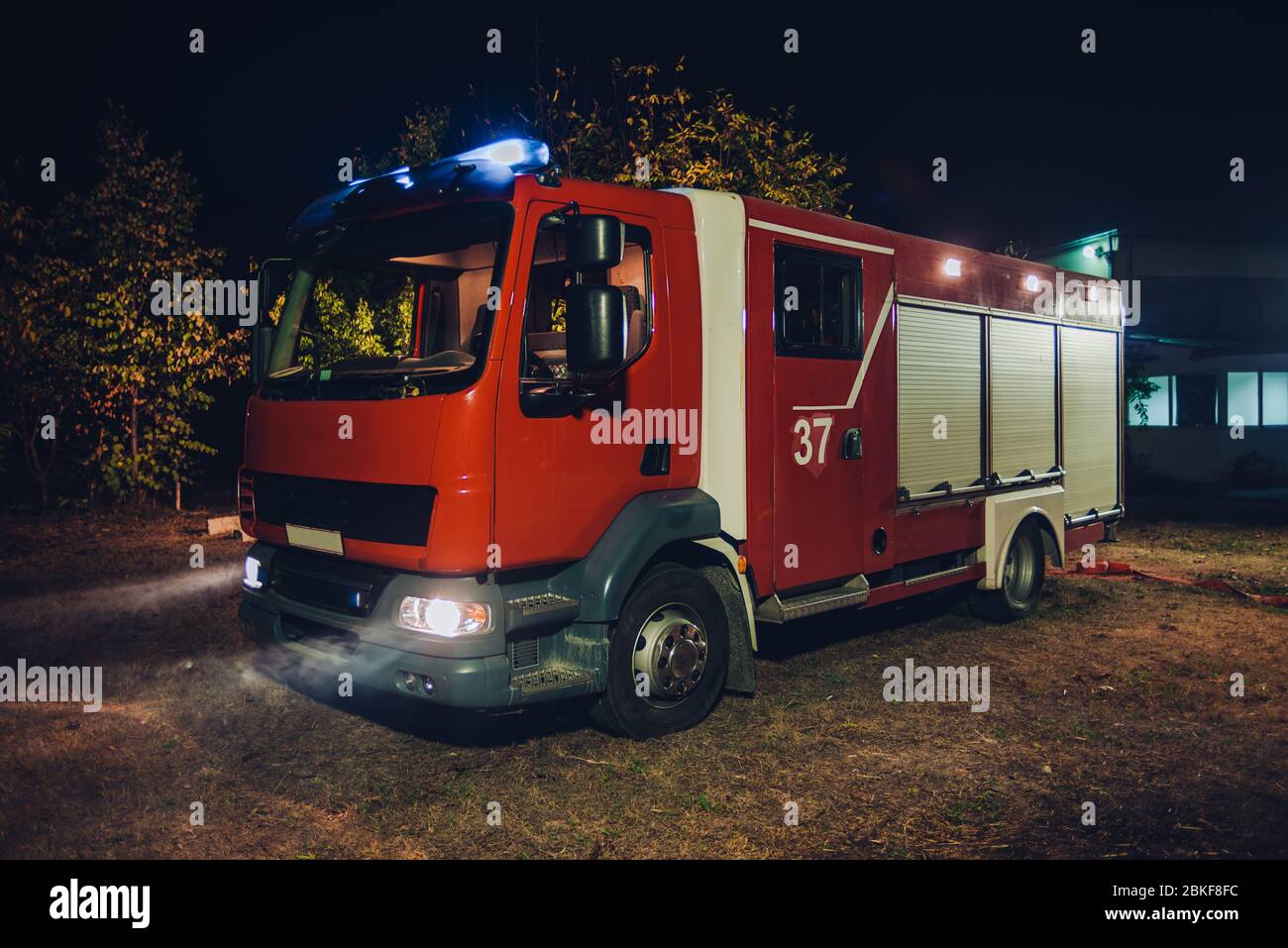 Fire truck with flashing lights during a firefighting operation Stock ...