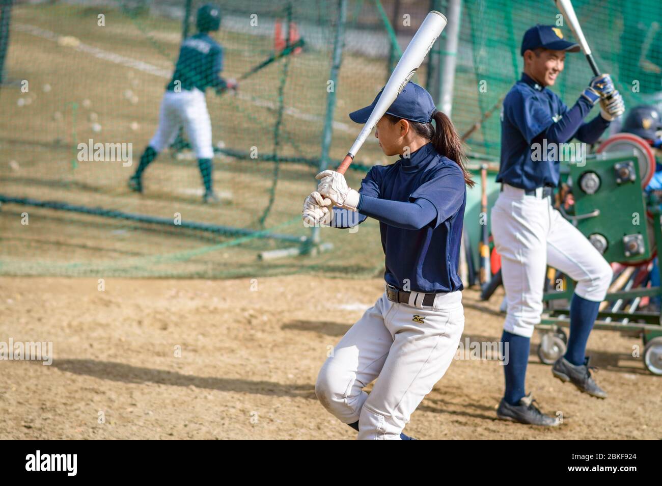 Osaka / Japan - November 25, 2017: Baseball player girl practicing baseball bat swing in Osaka, Japan Stock Photo