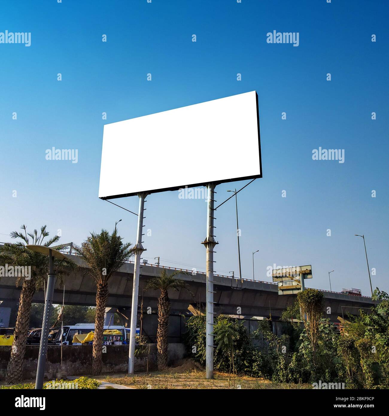 Blank billboard at roadside good viewership against clear sky Stock Photo