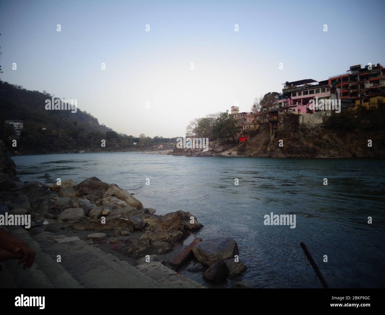 Ganges Riverbank clean water flowing in rishikesh, India Stock Photo