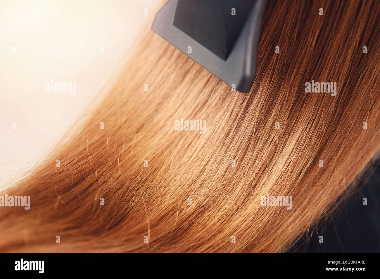 Barber makes hair curling hi-res stock photography and images - Alamy