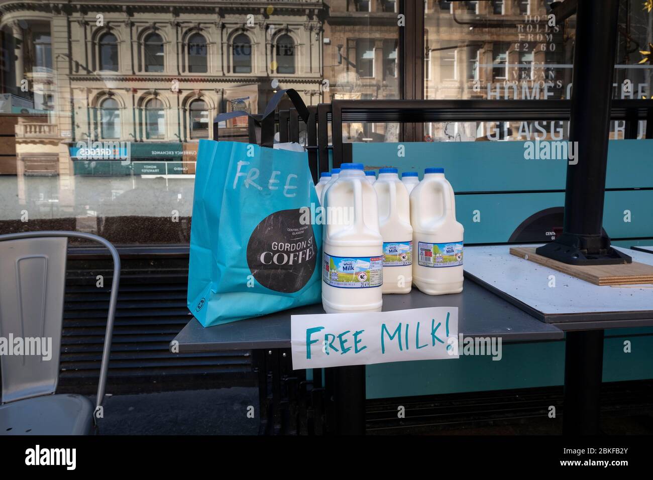Free milk outside of Gordon street coffee next to Glasgow's Central station during the Covid-19 lockdown. Stock Photo