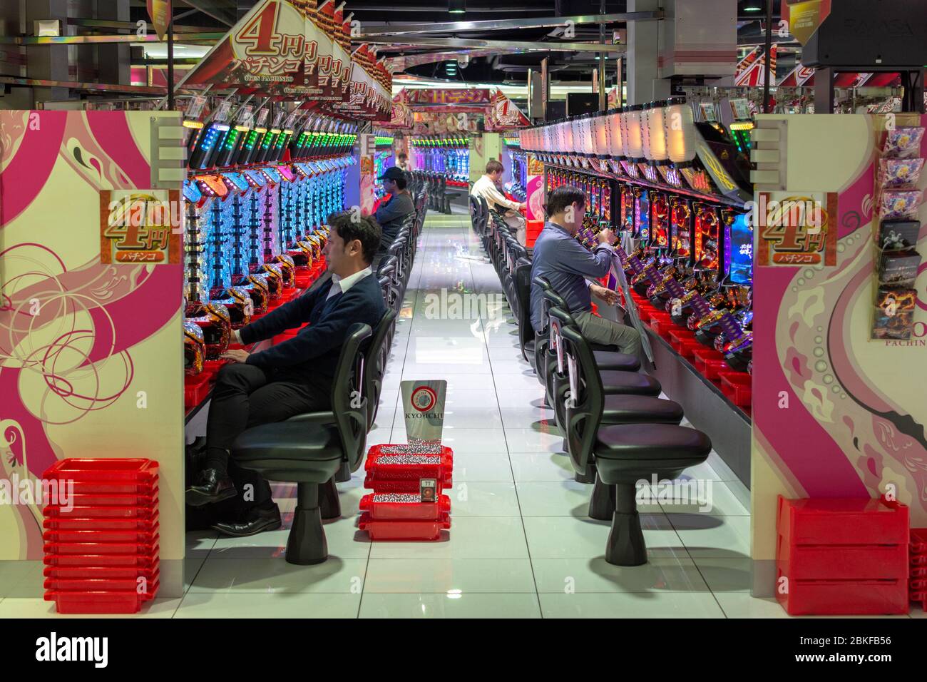 Osaka / Japan - October 6, 2017: People gambling on Pachinko slot machines in Osaka, Japan Stock Photo