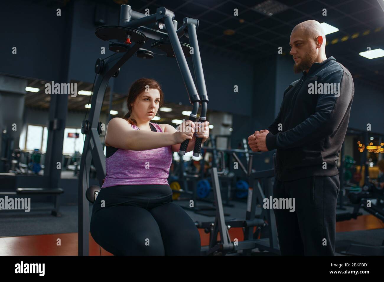 Overweight woman doing exercise in gym Stock Photo Alamy