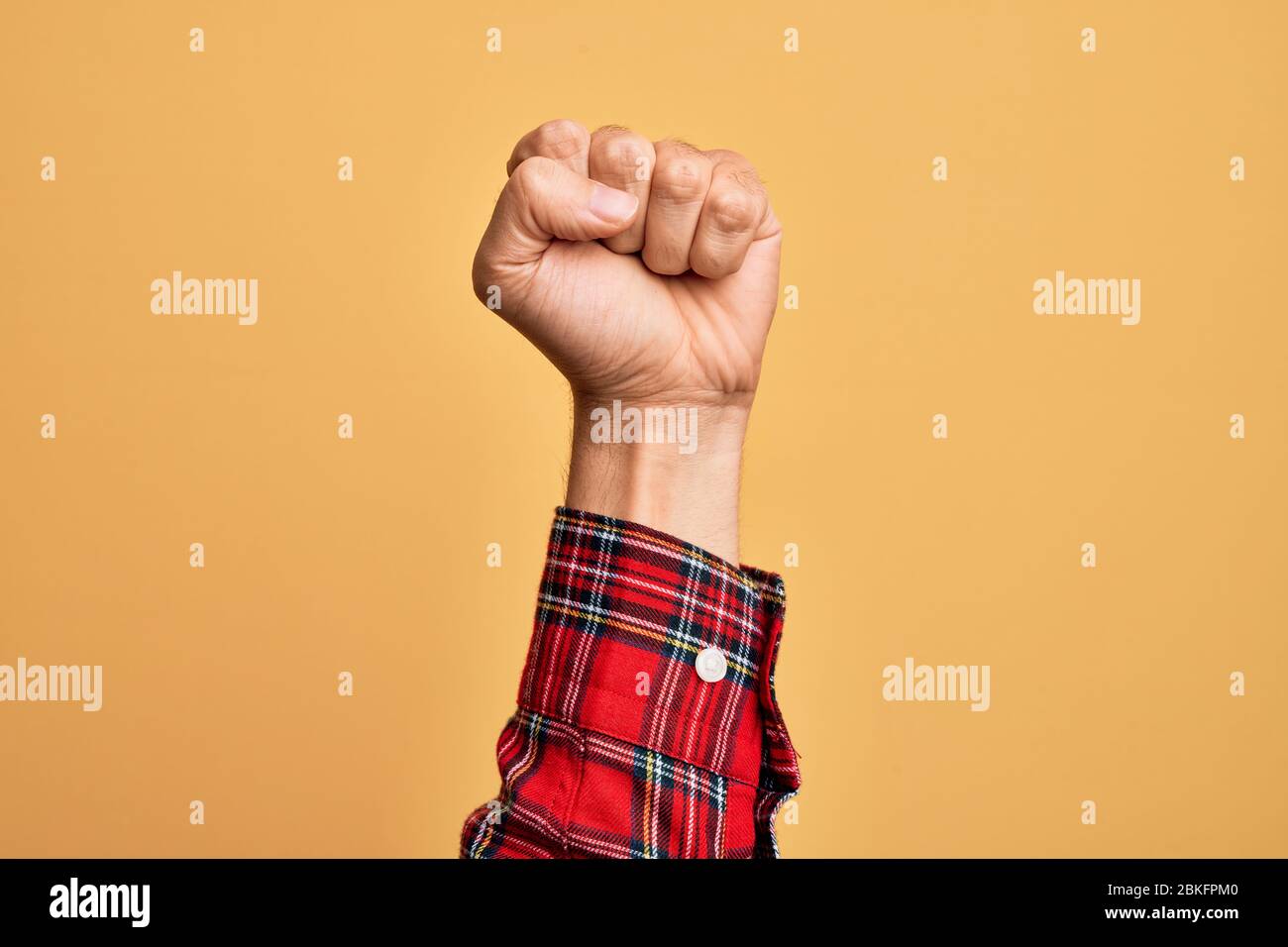 Hand Using Force Hand of caucasian young man showing fingers over isolated yellow ...