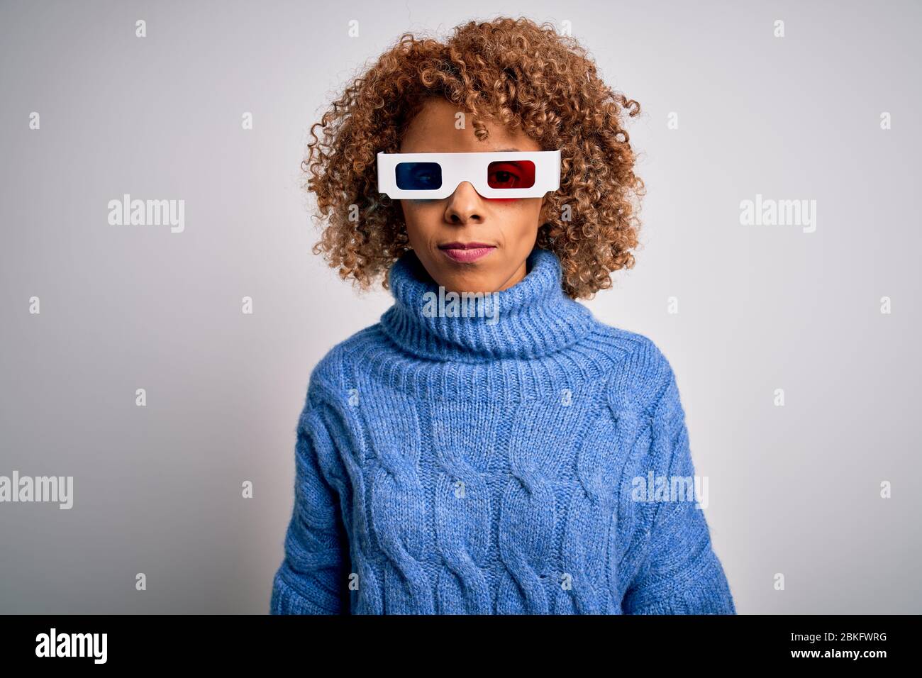 Young african american curly woman wearing 3d glasses over isolated ...