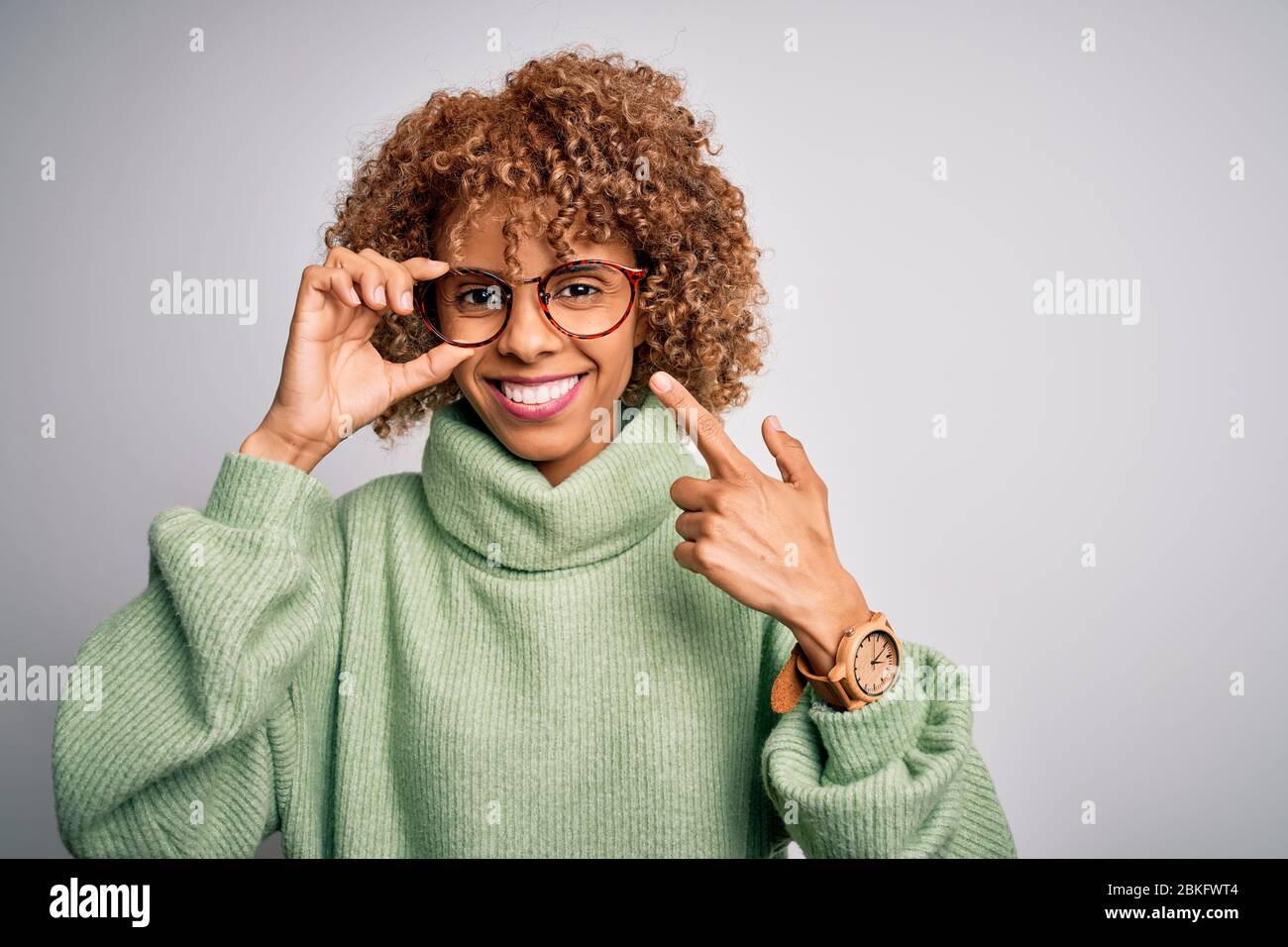 African american optical woman with curly hair wearing glasses over ...