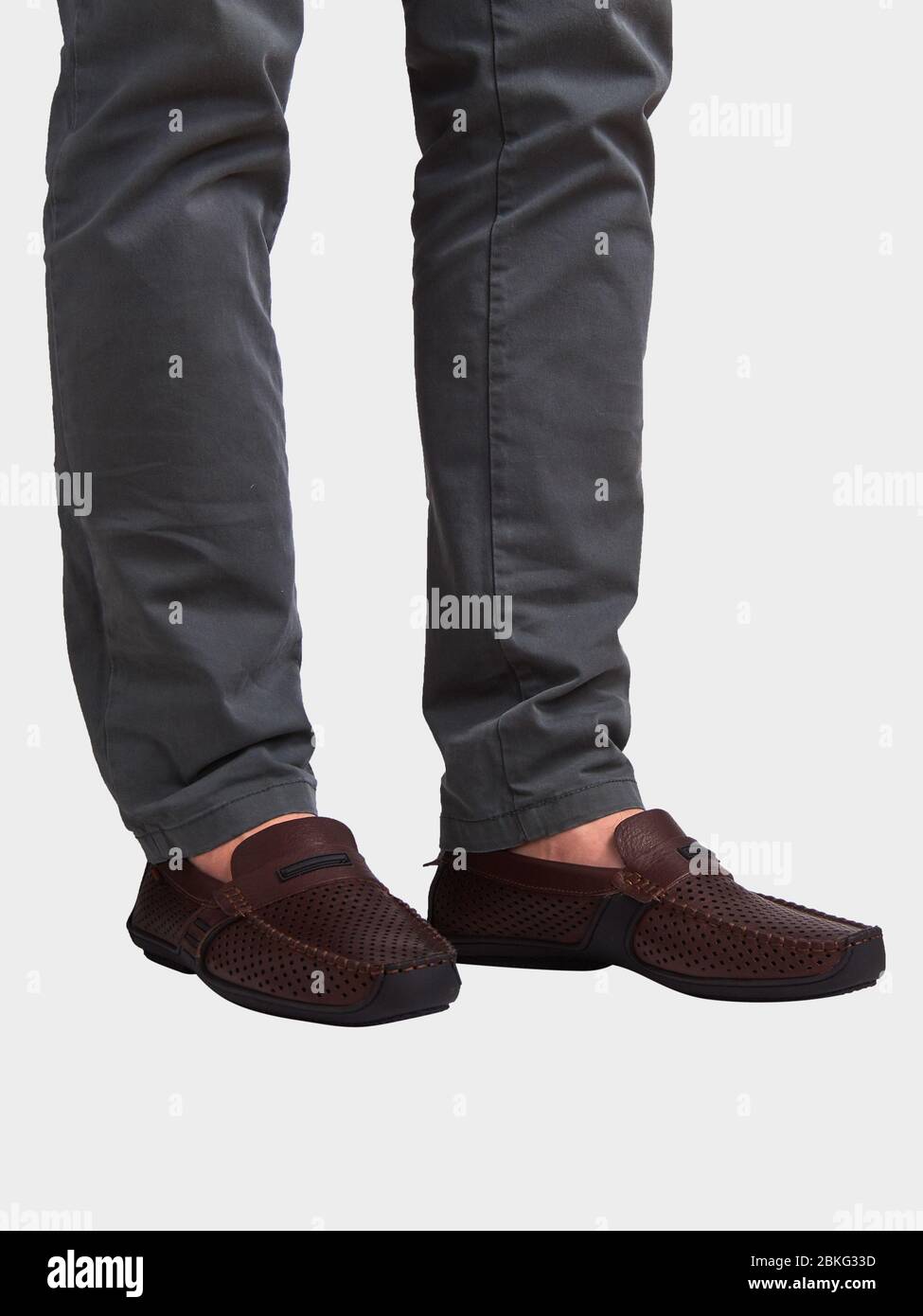 Men's brown leather summer loafers with black sole. Isolated on a white background Stock Photo