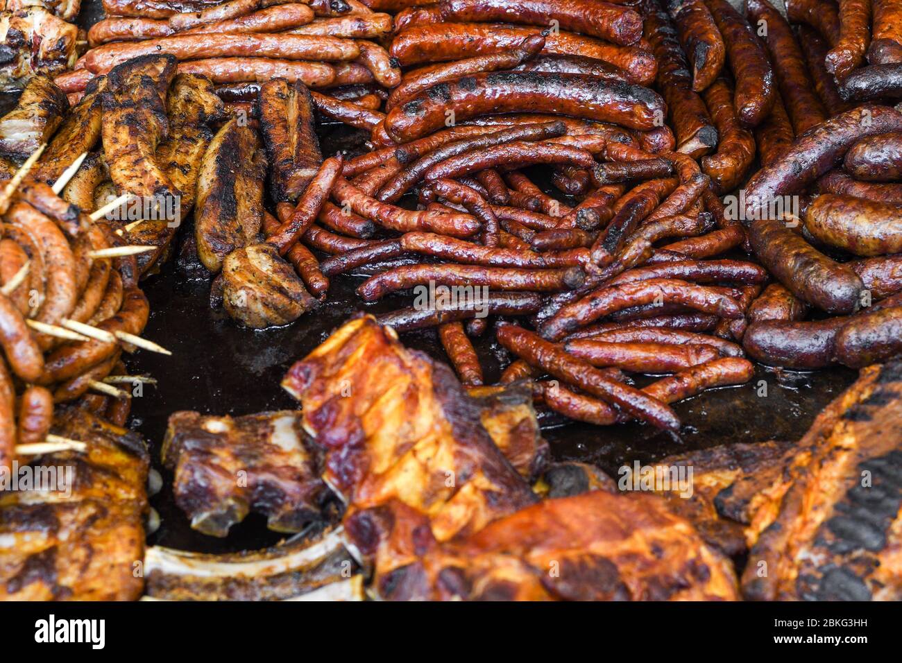 Assorted delicious grilled meat with vegetables over the counter on a