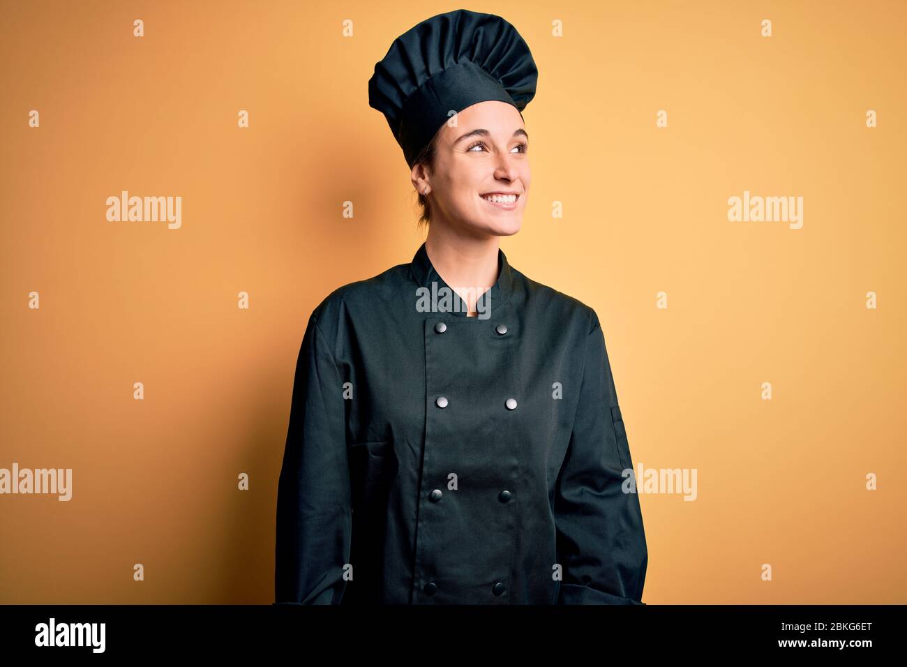 Side profile female chef smiling hi-res stock photography and images ...