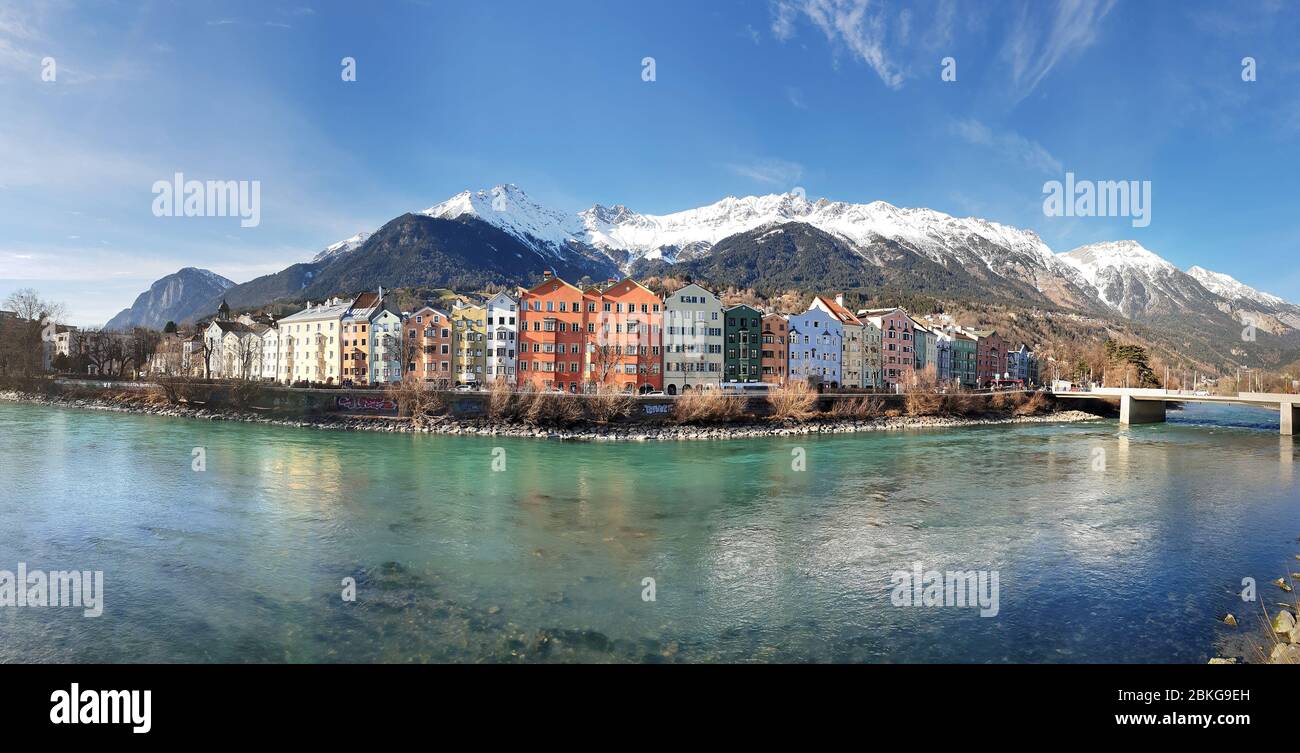 Panoramic view of Innsbruck with colourful houses along Inn river Stock Photo