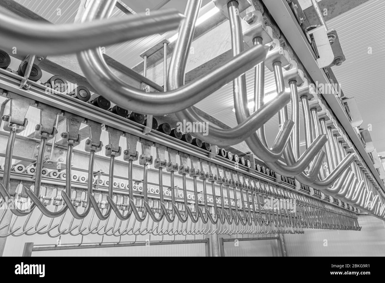 Meat hanging hook.Industrial loading dock area inside cold storage