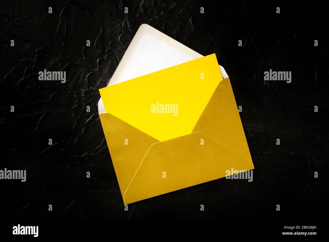 Download A Yellow Greeting Card In A Golden Envelope Mock Up Shot From The Top On A Black Background With A Place For Text Stock Photo Alamy Yellowimages Mockups
