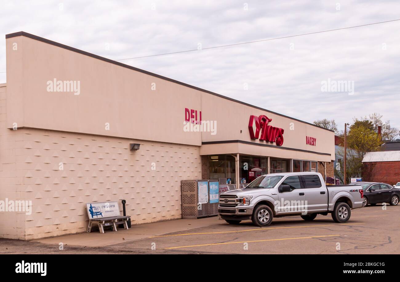 Tops Grocery store, a popular, regional chain with a Ford truck parked out front on an overcast spring day, Youngsville, Pennsylvania, USA Stock Photo