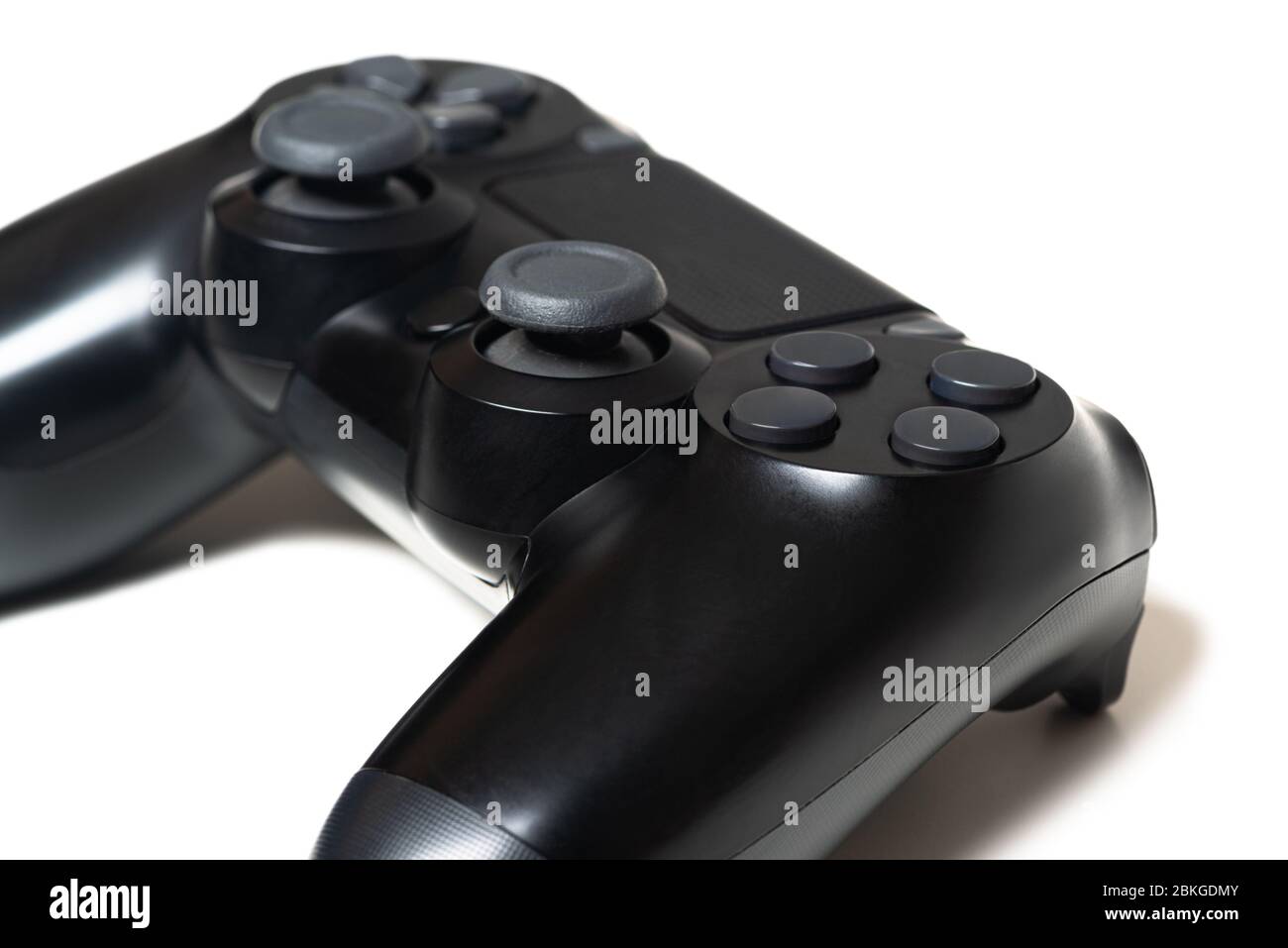 Video game black controller closeup white background Stock Photo