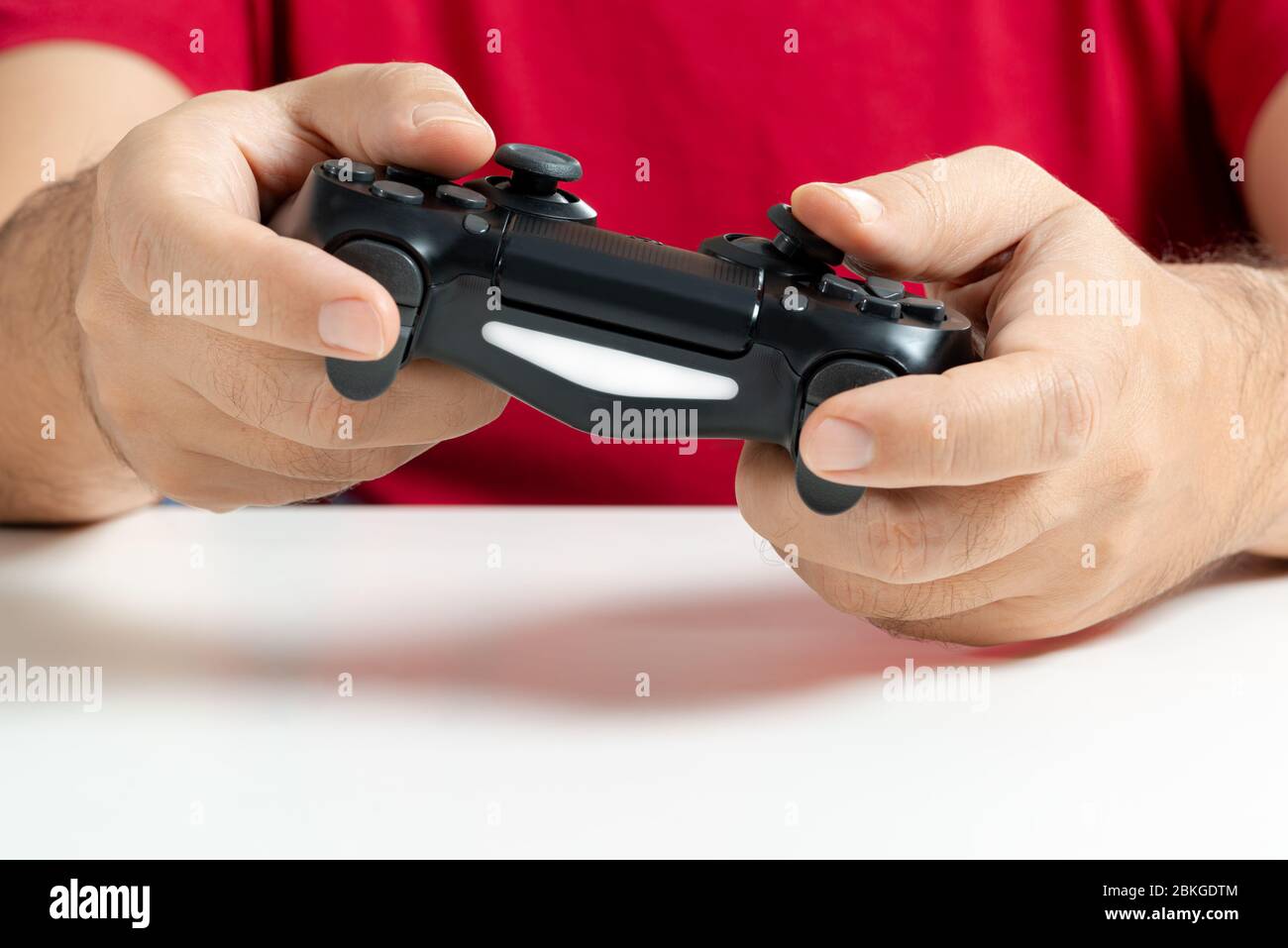 Video game controller in hands white background Stock Photo