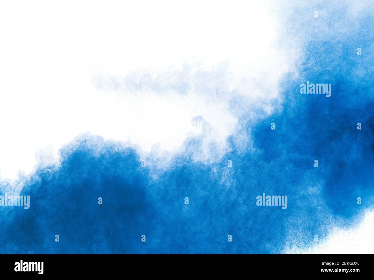 Bizarre forms of blue powder explosion cloud on white background ...