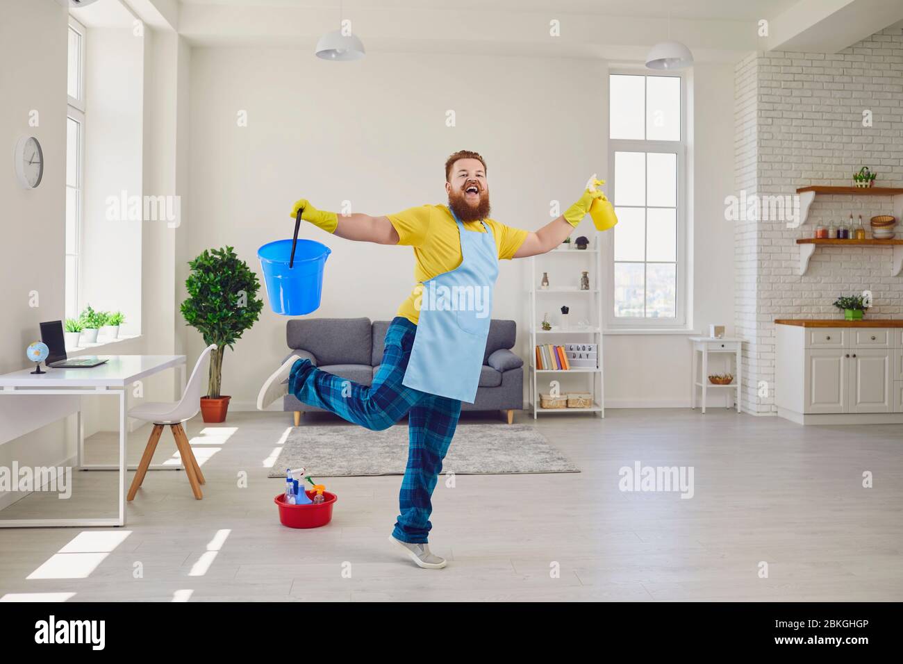 Funny fat man cleaning gloves is cleaning in the room Stock Photo Alamy