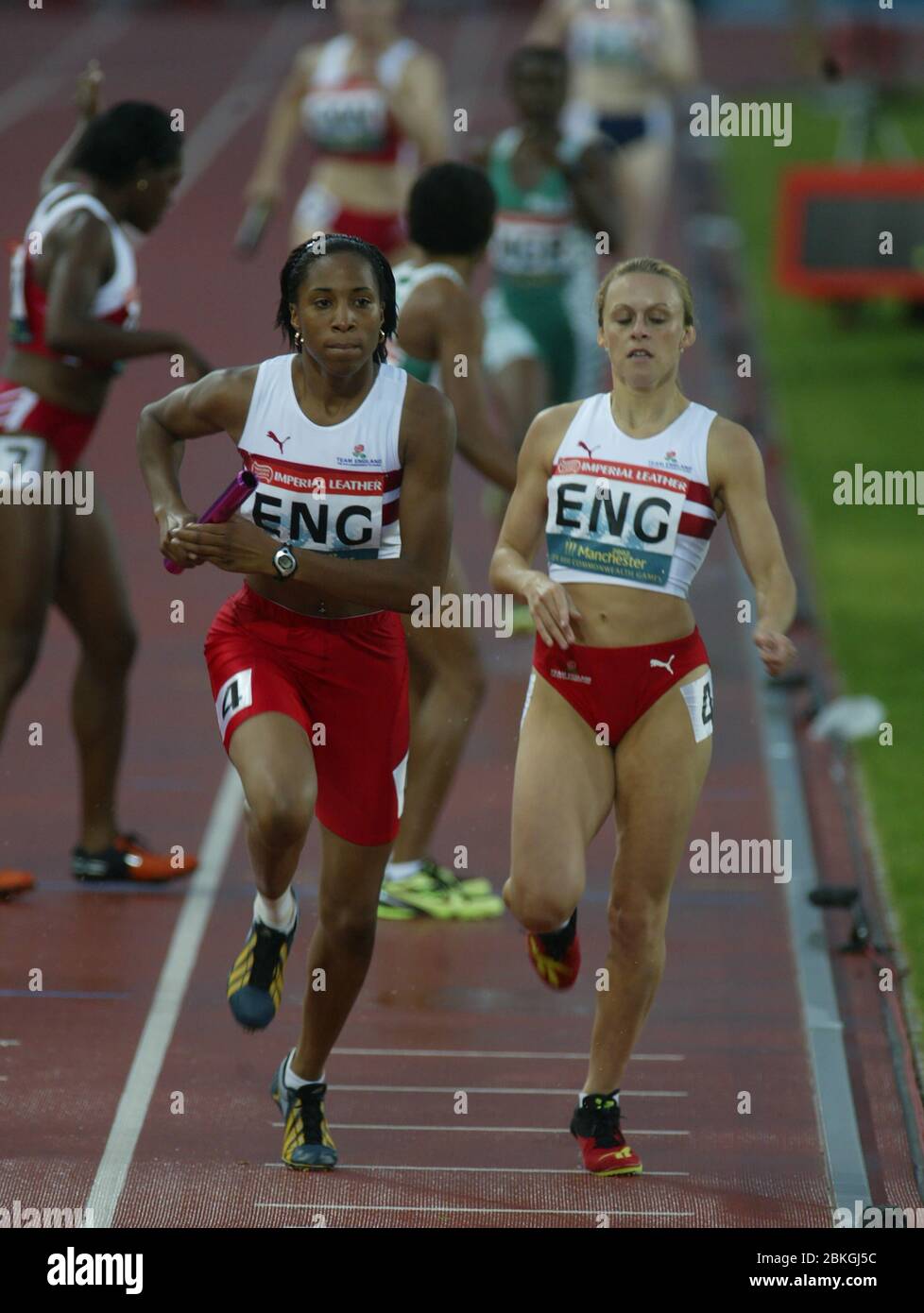 MANCHESTER JULY 30 Lisa Miller of England takes baton from Jenny