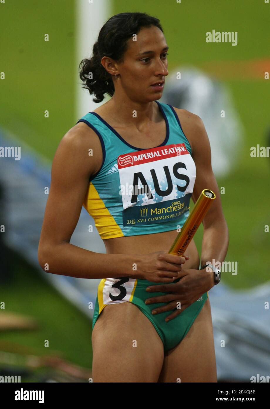 MANCHESTER - JULY 30: Kylie WHEELER of Australia first Leg compete in Women's 4 x 400m Semi-Final 1 at City of Manchester Stadium during the 2002 Comm Stock Photo
