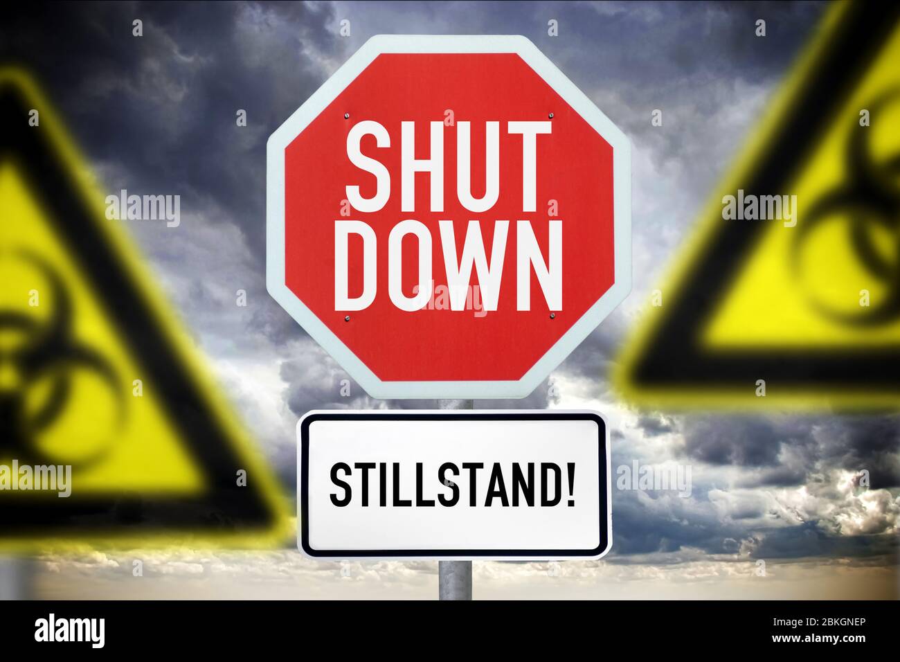PHOTOMONTAGE, signs with inscription shutdown and halt and Biogefährdungsschilder, Symbolfoto Corona shutdown  /  FOTOMONTAGE, Schilder mit Aufschrift Stock Photo