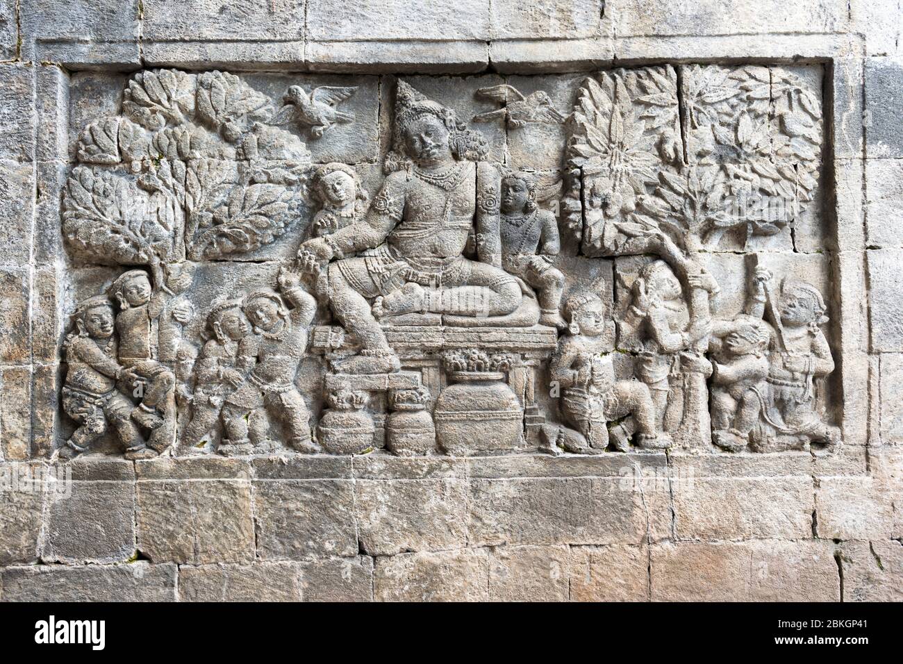 Bas-relief of a seated male figure at Mendut Temple, Borobudur, Mageland, Jawa Tengah, Indonesia Stock Photo