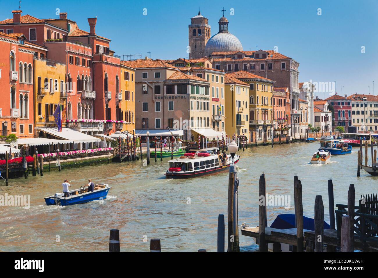 Venice, Venice Province, Veneto Region, Italy.    Traffic, including a Vaporetto, or ferry, on the Grand Canal.  Venice is a UNESCO World Heritage Sit Stock Photo