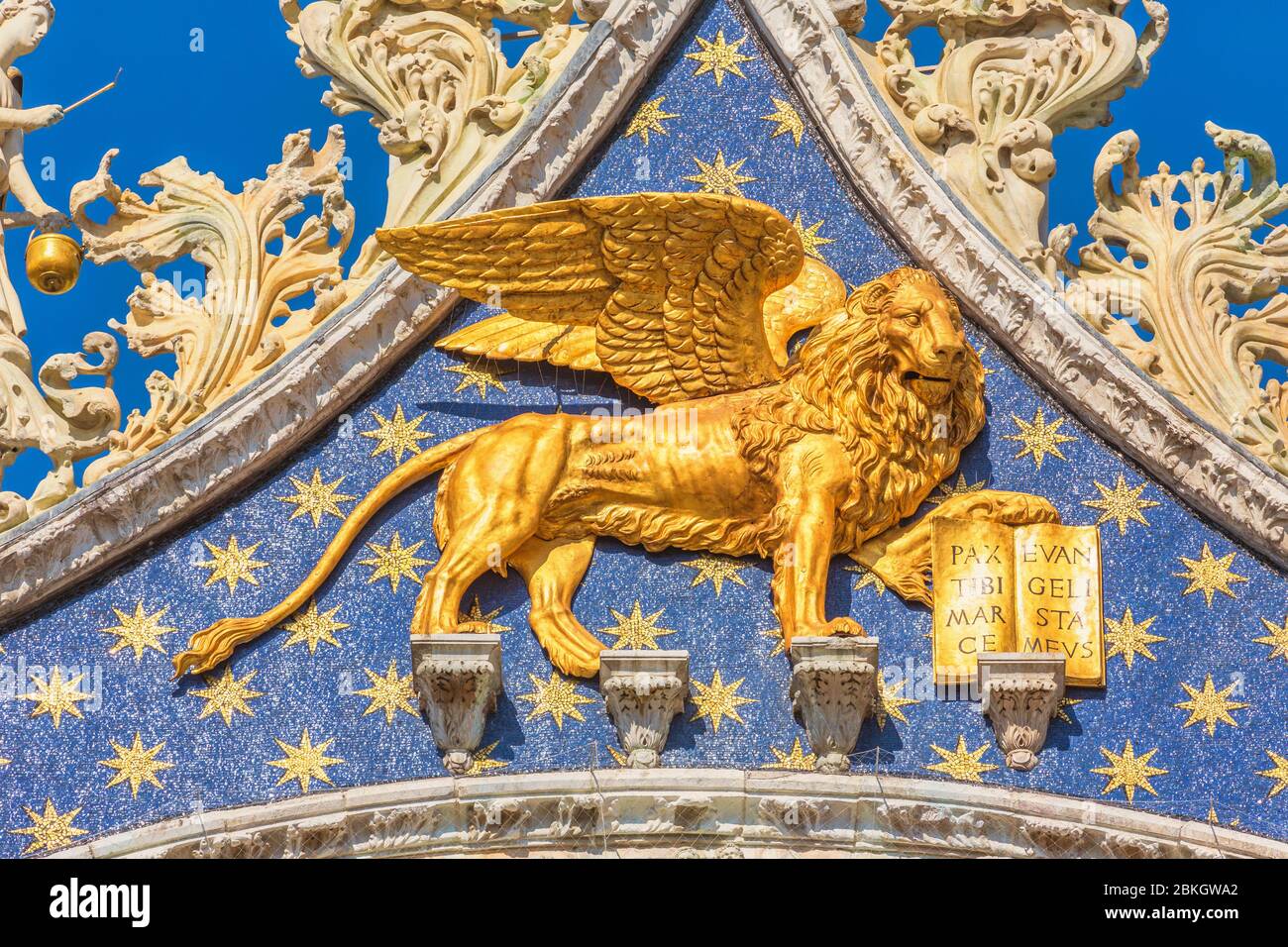 Venice, Venice Province, Veneto Region, Italy.   The winged lion above the entrance to St. Mark's basilica.  The lion is the symbol of Venice.  Venice Stock Photo