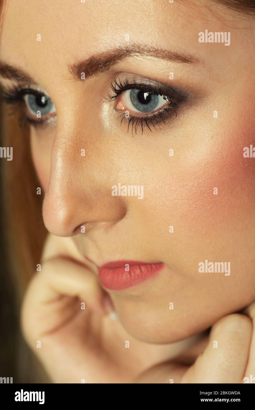 Close up of scared woman looking away Stock Photo