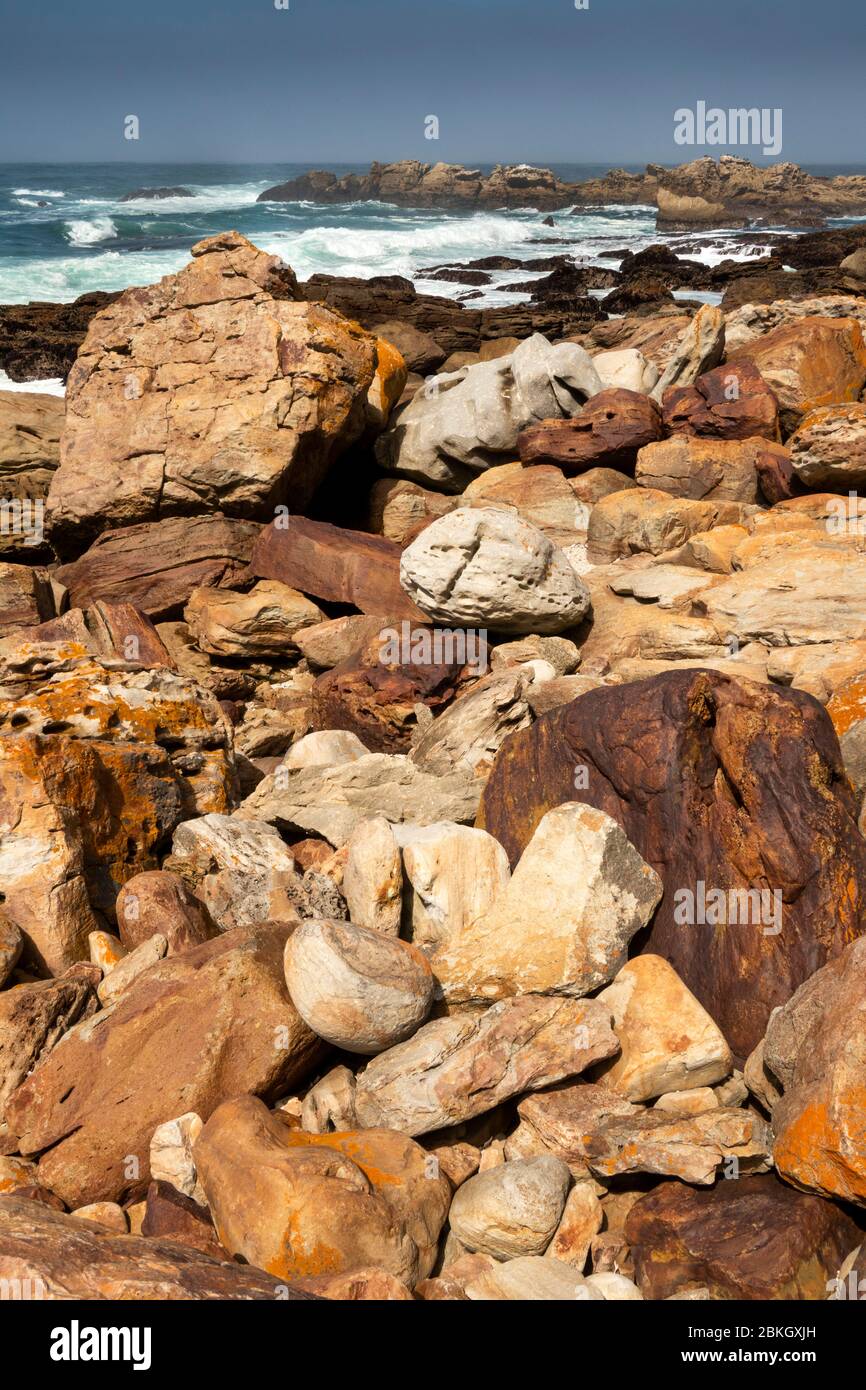 South Africa, Western Cape, Plettenberg Bay, Robberg Nature Reserve, Cape Seal, rocky coastline with waves crashing in behind Stock Photo