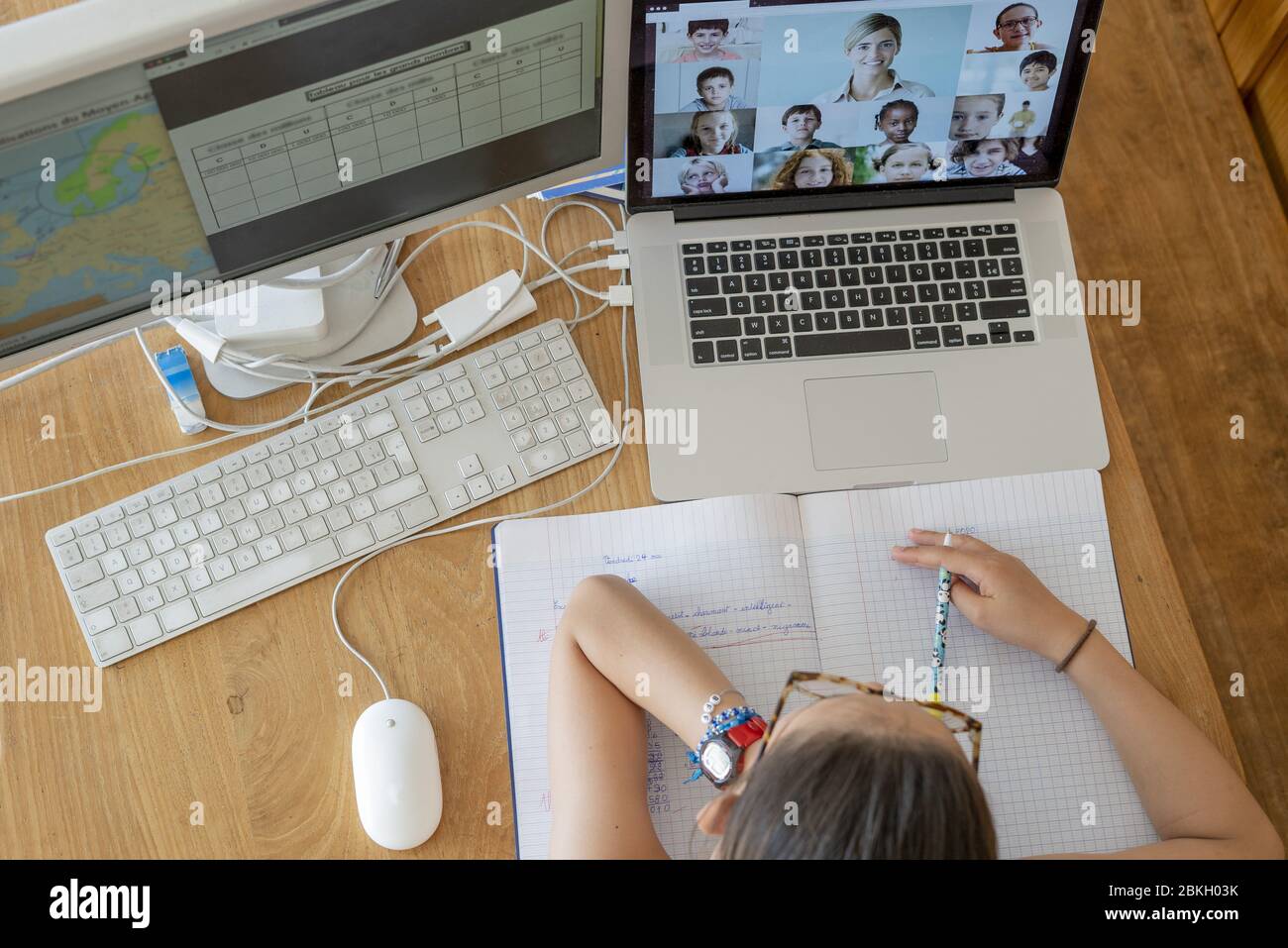 Girl attending online school classes from home Stock Photo