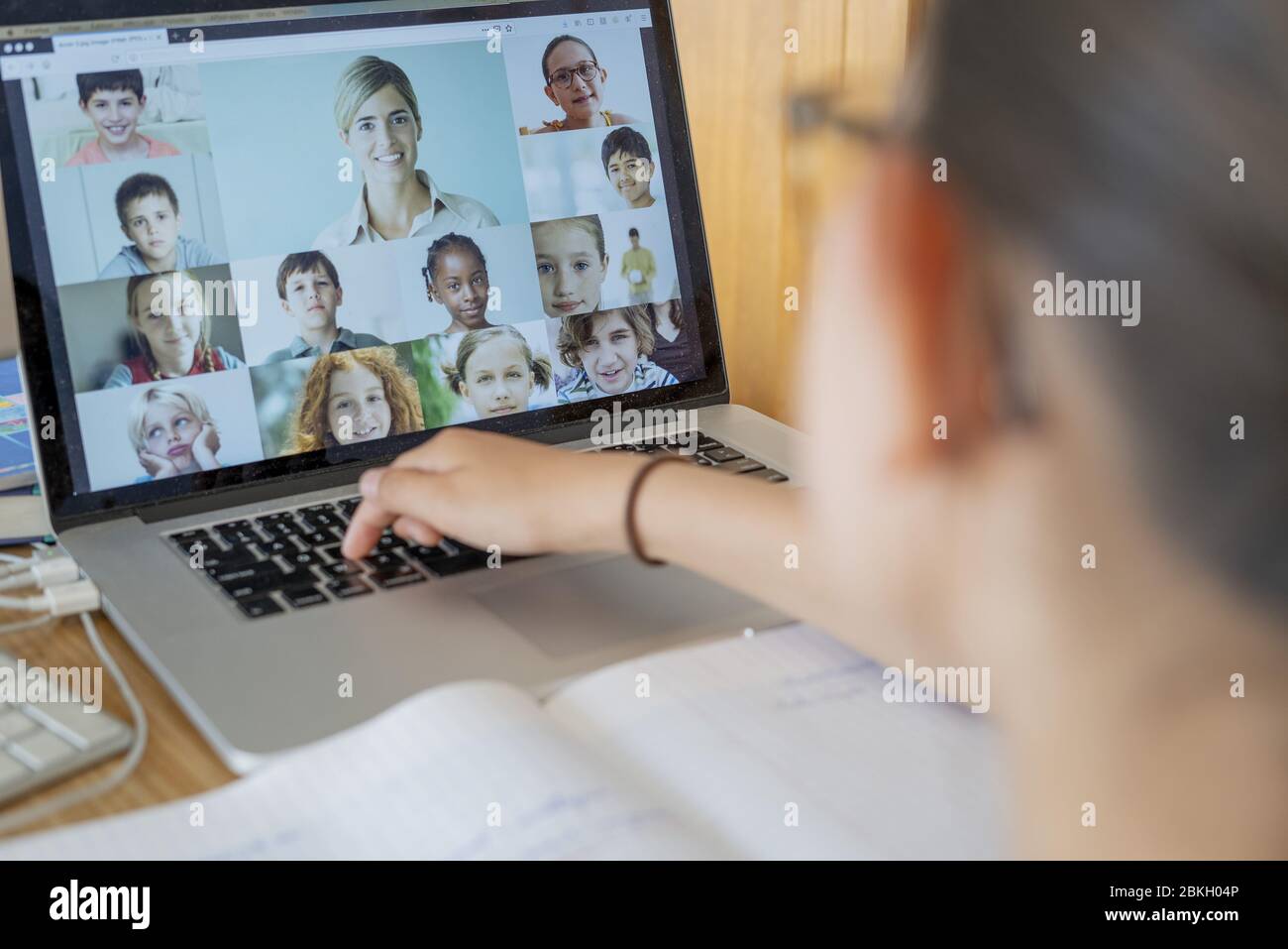 Girl attending online school classes from home Stock Photo