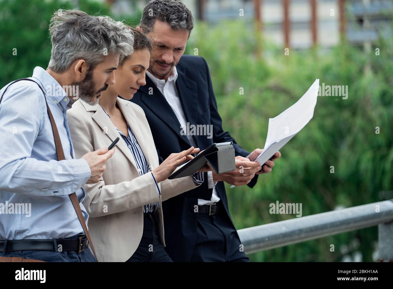 Architects using digital tablet outdoors Stock Photo