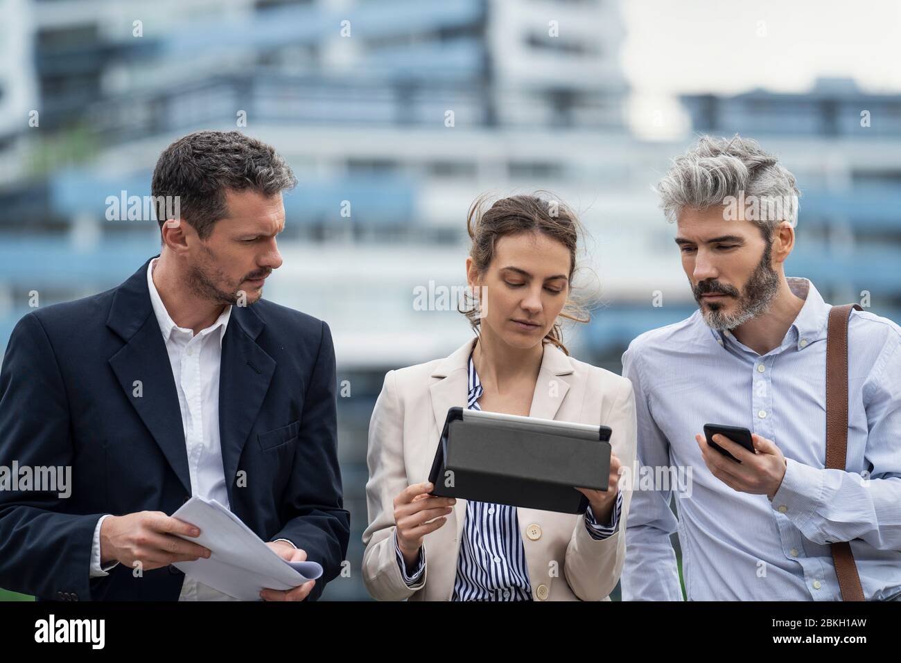 Architects using digital tablet outdoors Stock Photo