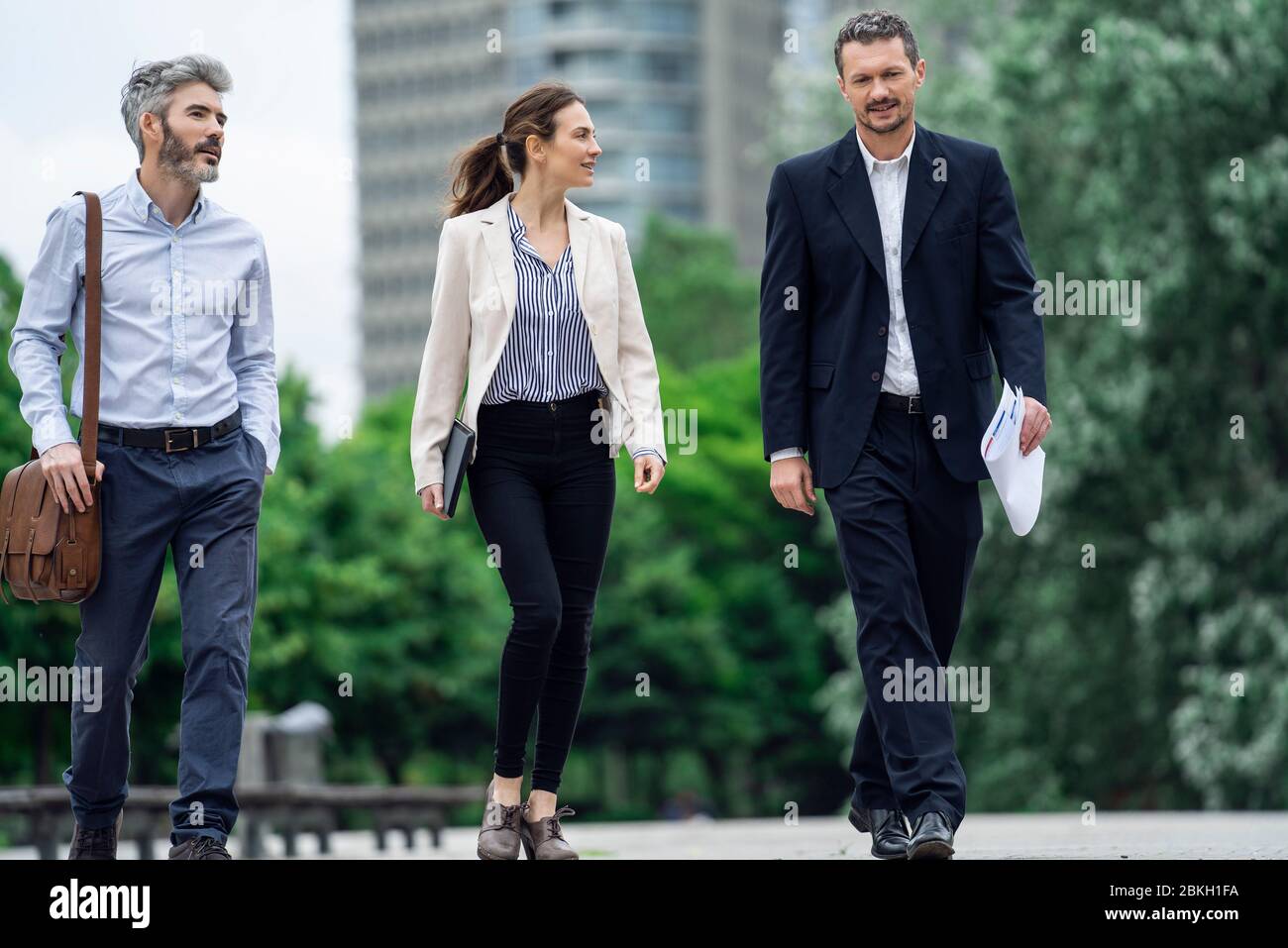 Architects talking with each other in public park Stock Photo