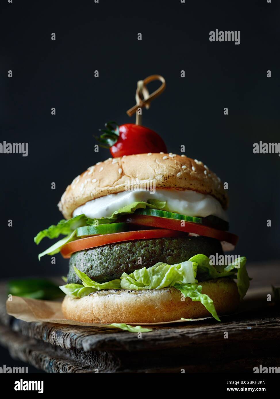 fresh tasty meat free burger on old dark wooden table Stock Photo