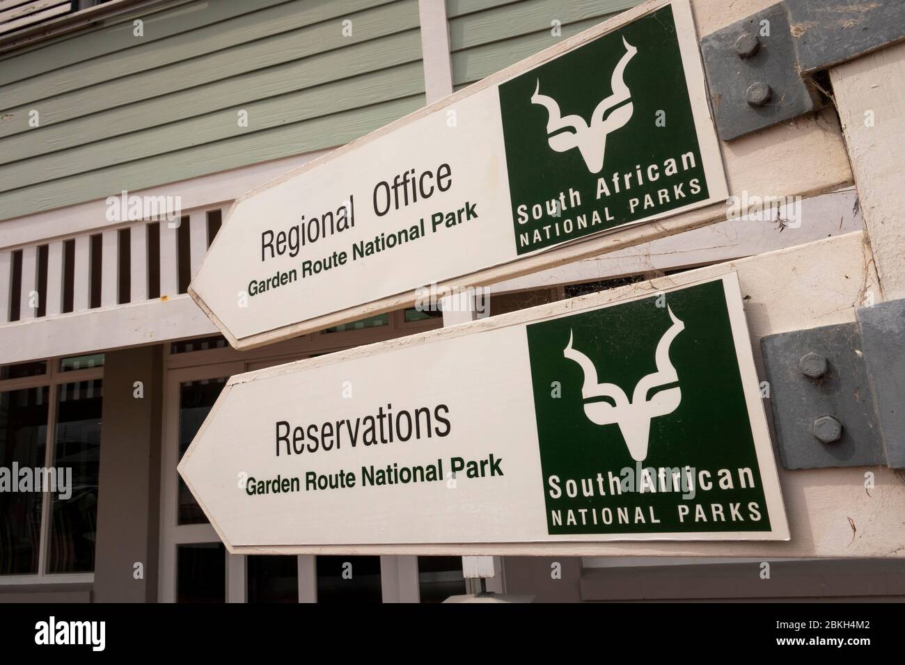 South Africa, Western Cape, Knysna, Thesen’s Island, Harbour Town, Garden Route National Park office SANPARKS office and reservations signs Stock Photo