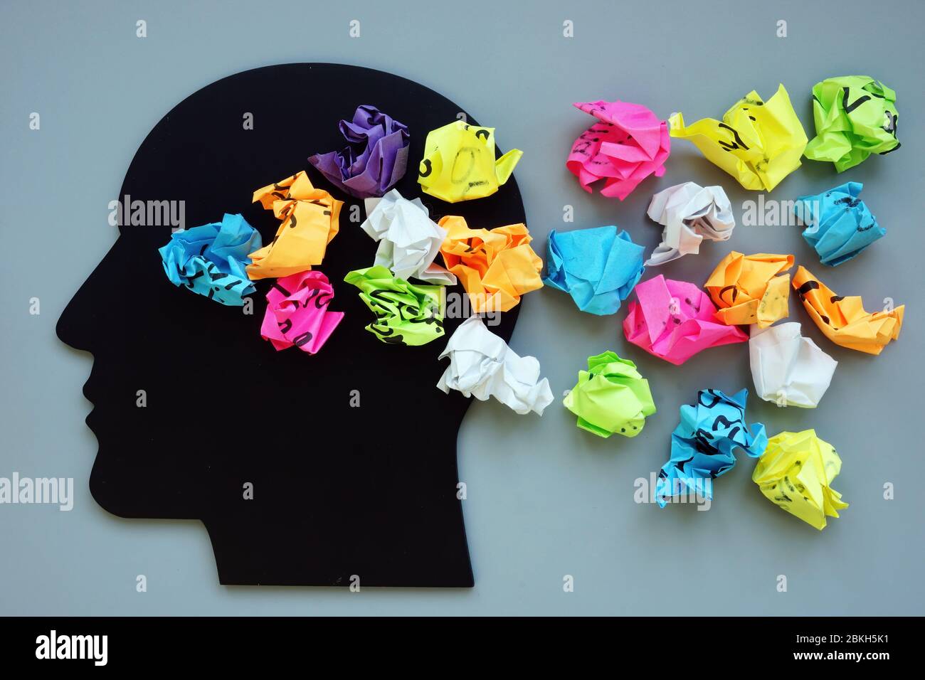 Thoughts, ideas and mindfulness concept. Head and paper balls. Stock Photo