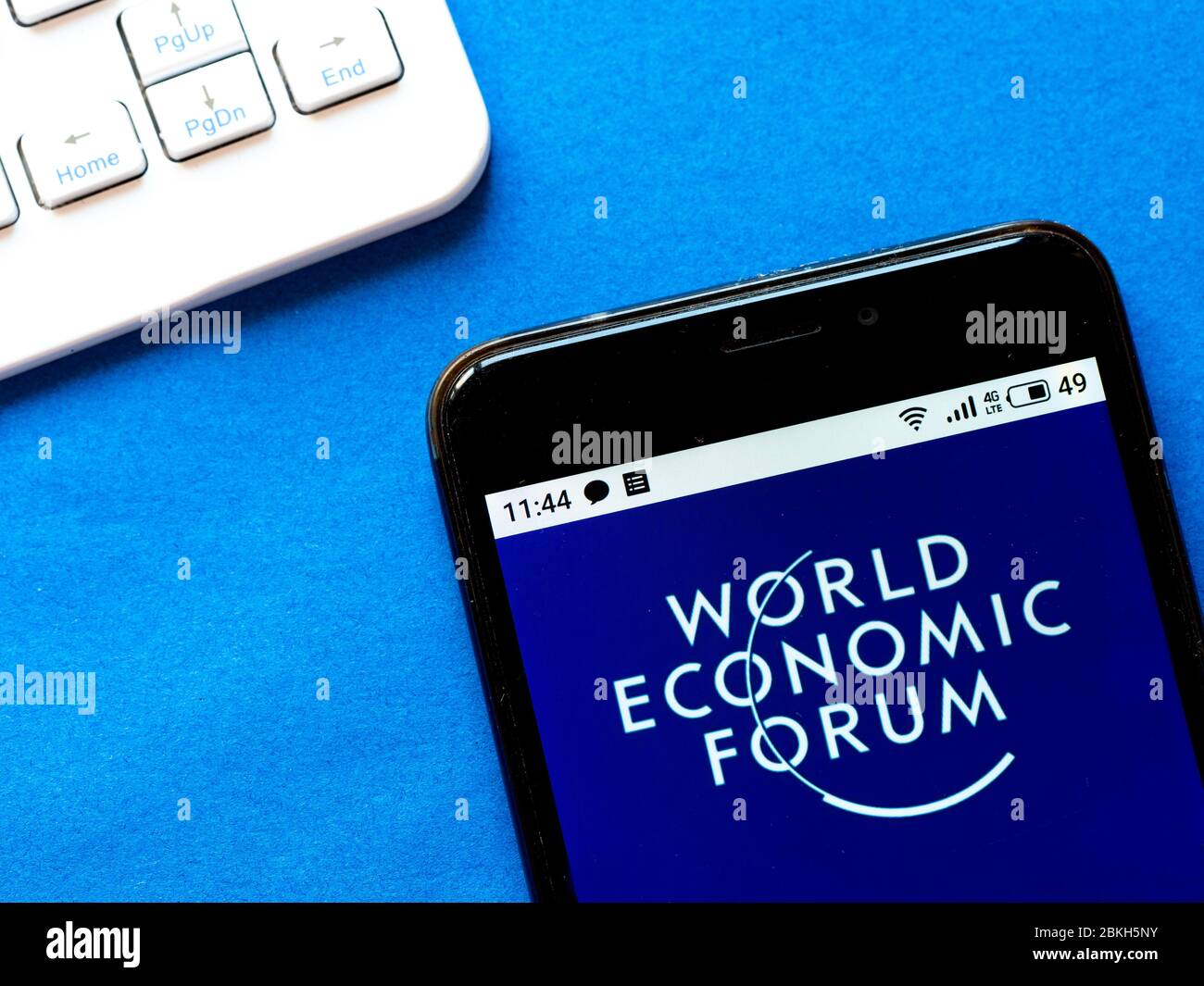 In this photo illustration World Economic Forum logo is seen displayed on a smartphone Stock Photo