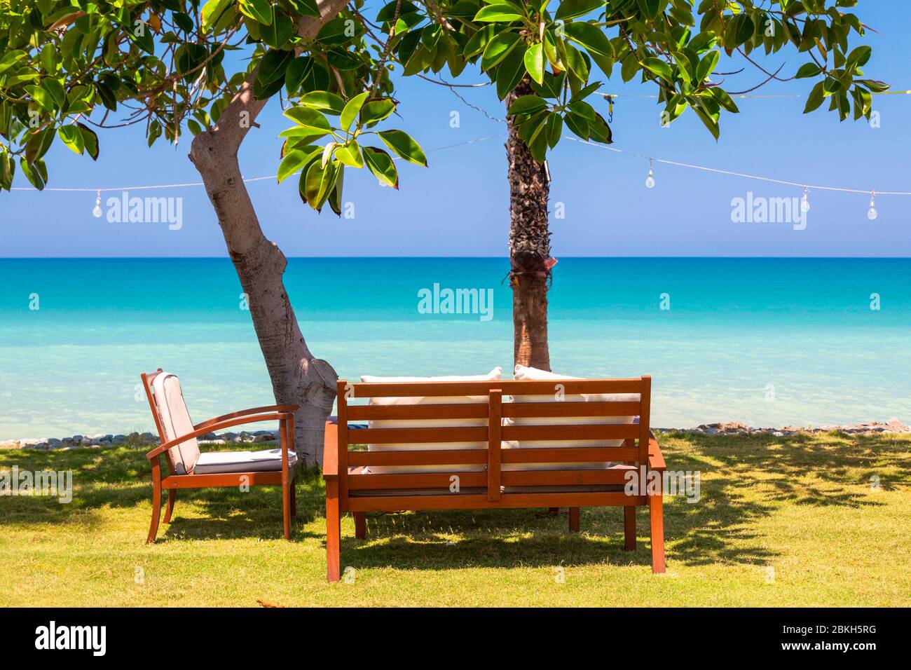 Outdoor furniture on the waterfront at Argaka Beach, Cyprus Stock Photo