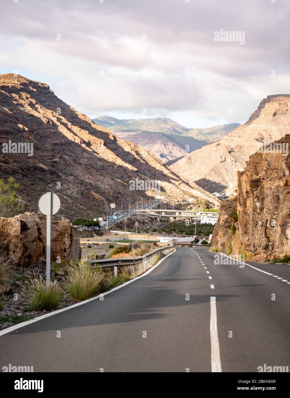 Mountain Pass. An empty road leading into the rocky mountains of Gran Canaria, one of the larger of the Canary Islands. Stock Photo