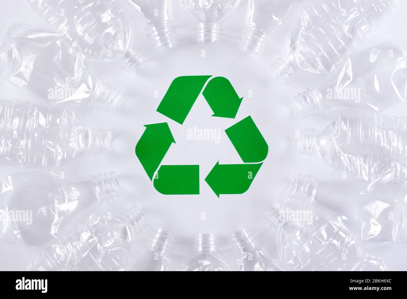 Frame of used plastic bottles background with recycle sign. Recycle and World Environment Day concept. Stock Photo