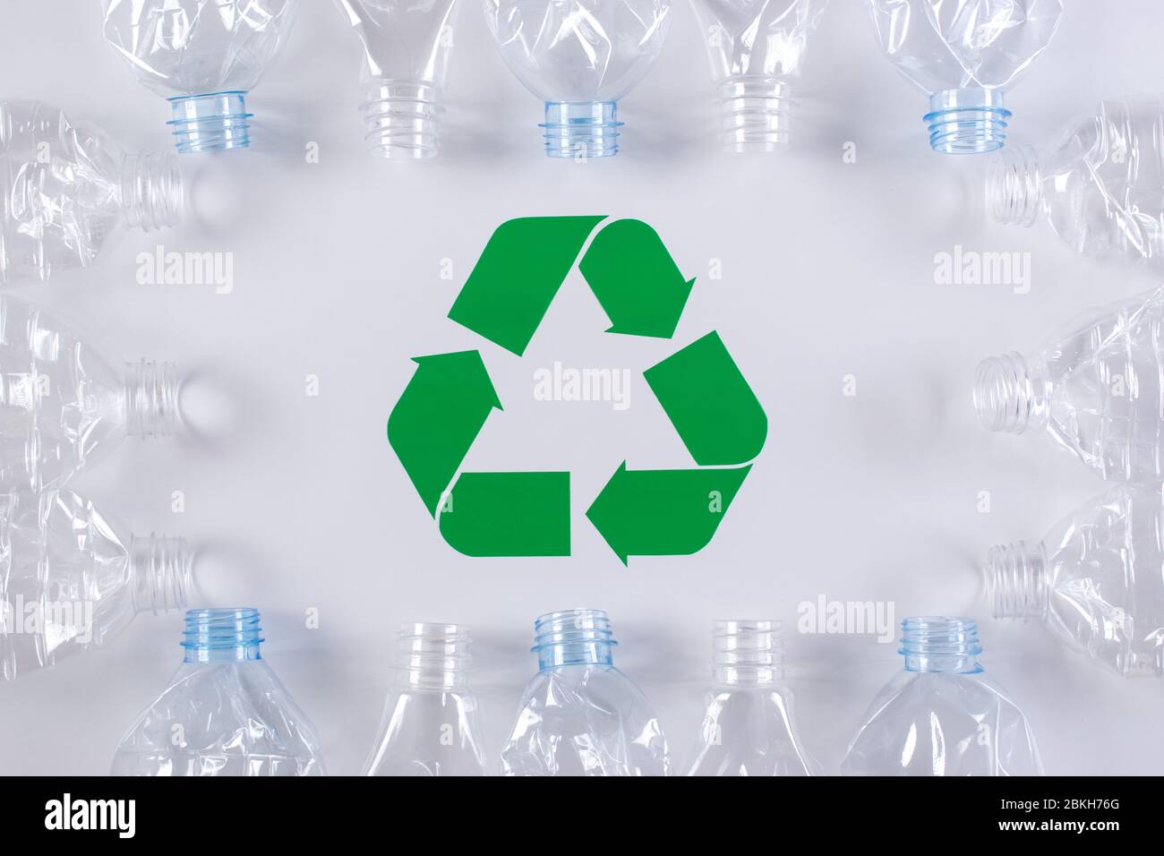 Frame of used plastic bottles background with recycle sign. Recycle and World Environment Day concept. Stock Photo