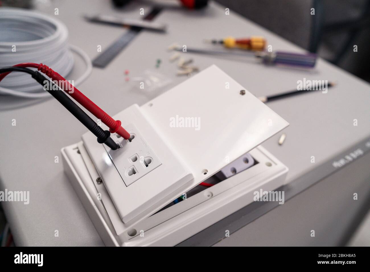 Digital multi meter to test measure the voltage at the power outlet on