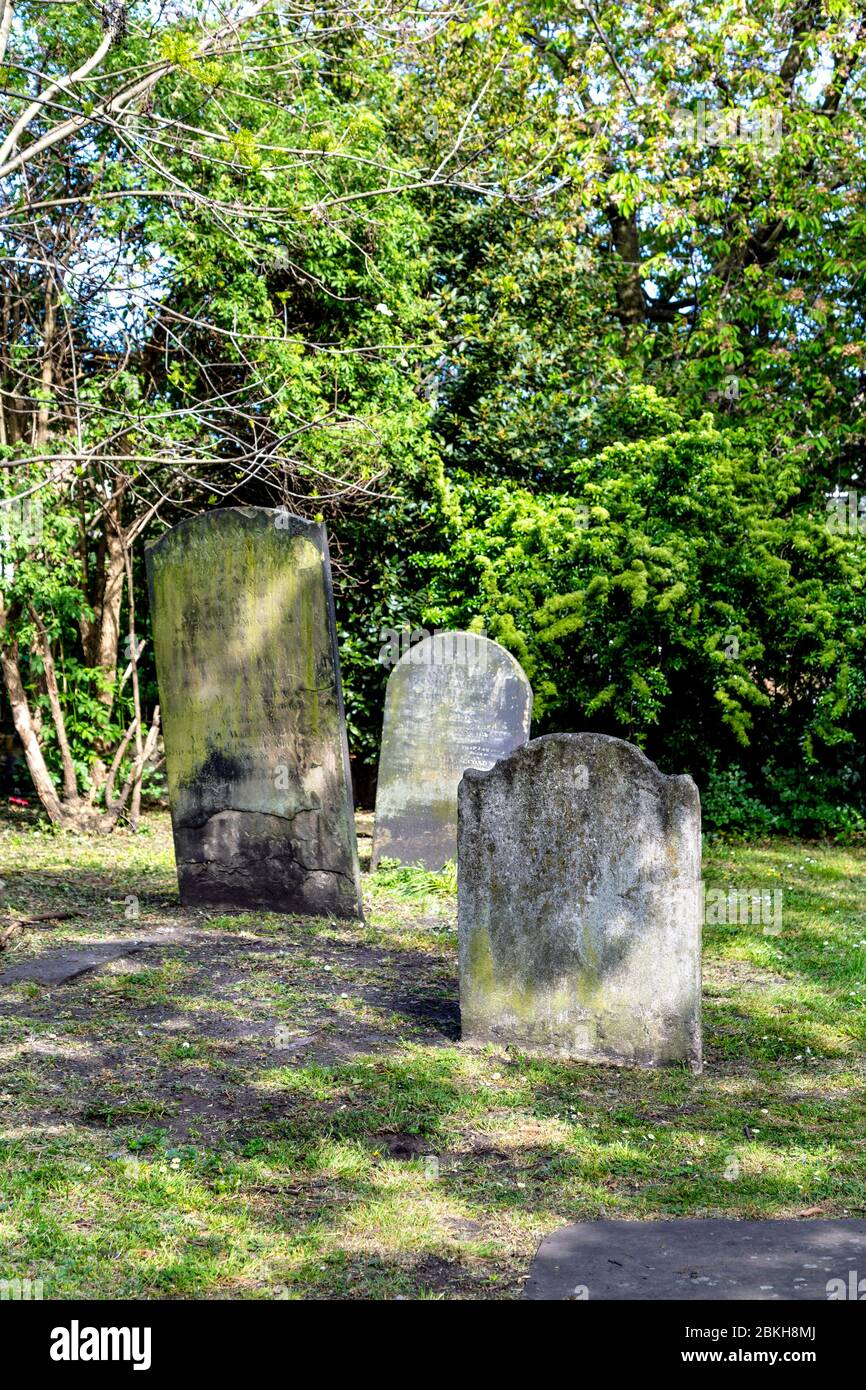 Old headstones at the former site of Stepney Meeting House Burial Ground (Mercers Burial Ground), London, UK Stock Photo
